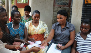 small group of women sharing money