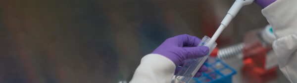 Person in a lab doing a test with a test tube