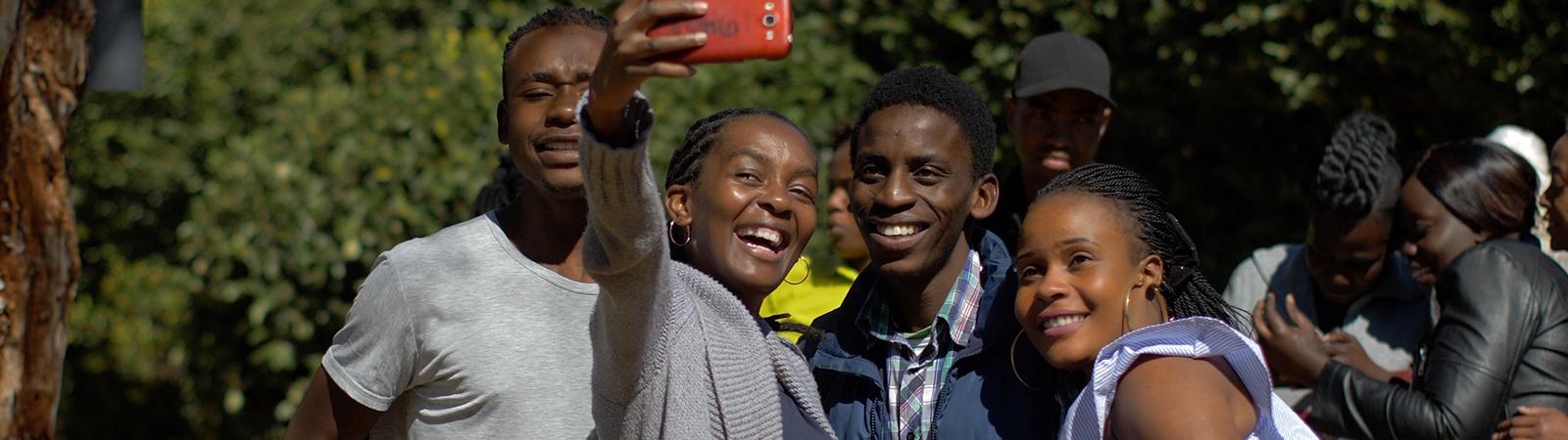 Group of young people taking a selfie